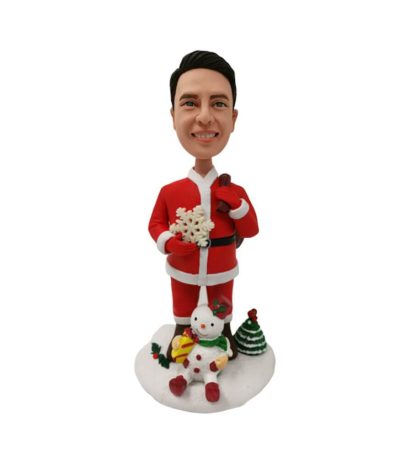 Santa Holding Snowflake and Snowman at His Feet Bobblehead